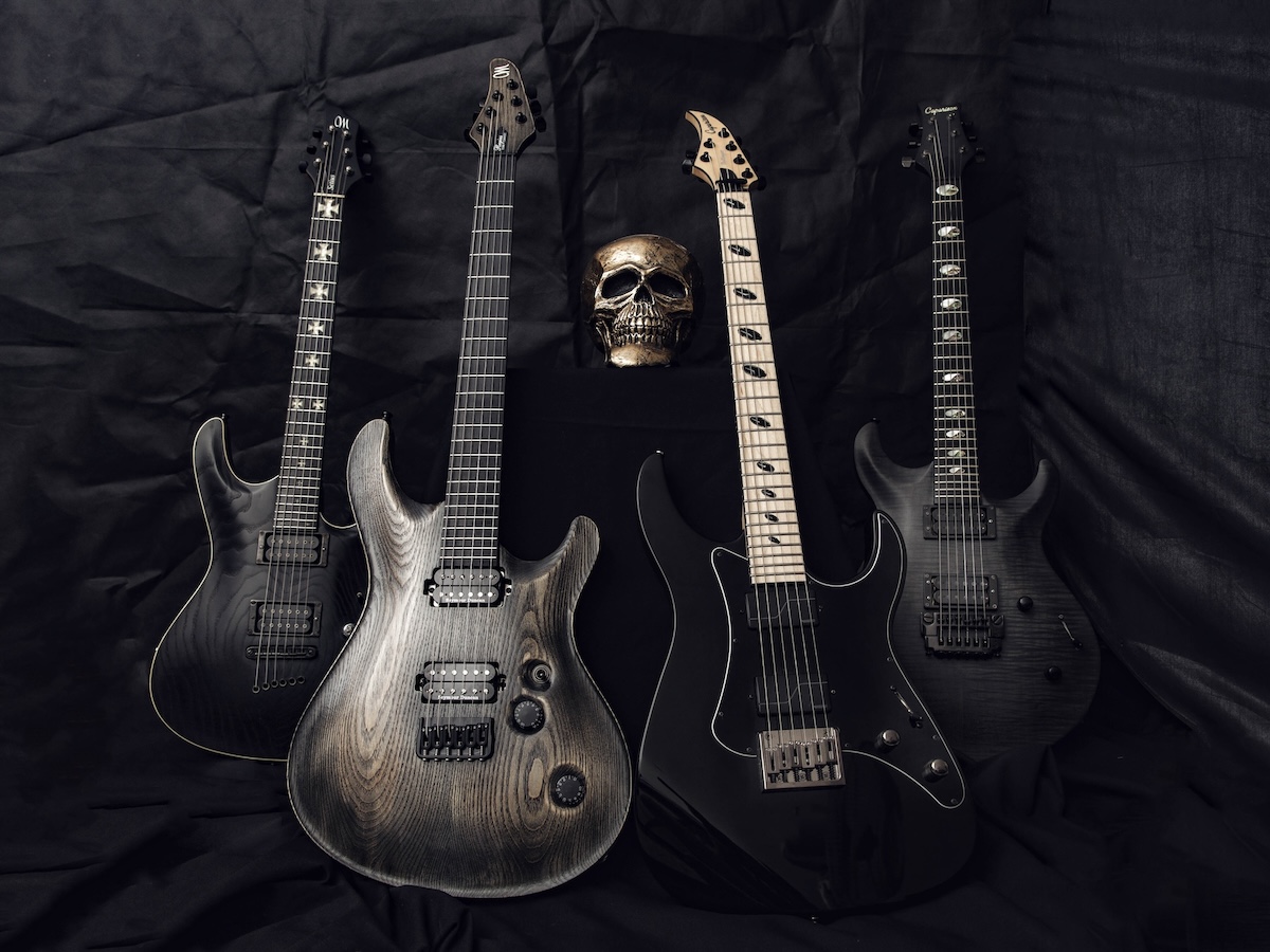 Guitars and a skull on a dark background